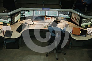 Personnel at work in control room on a chemical plant