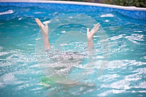 Persons hand over the water, asking for help, person drowning