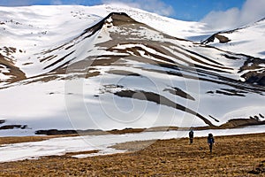 Persons Walking Tundra in Svalbard