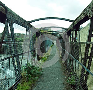 perspect old rusting railway footbridge photo