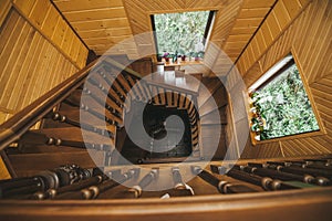 A perspective of the beautiful old wooden spiral staircase in house