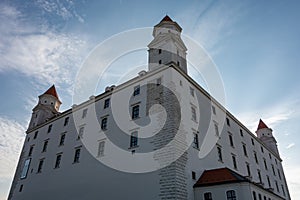 Perspective bottom view of Bratislava castle in Slovakia, Europe in backlight with blue sky