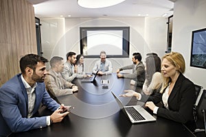 Perspective businesspeople having meeting in conference room