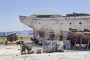 Perspective close shot of back side fishing boat on ground for painting of trunk at Lesvos, Kalloni