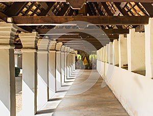 Perspective corridor to buddha in temple