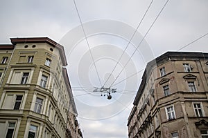 Perspective of a cross street in Wroclaw, Poland with contrast between new and old buildings and wire with street light