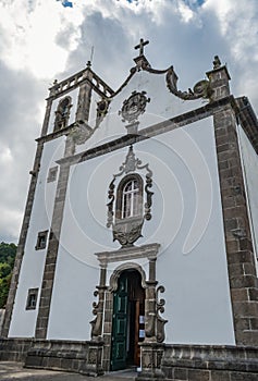 Perspective of the facade and bell tower of the church of Santa Ana in Furnas, SÃ£o Miguel Azores PORTUGAL photo