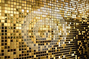 Perspective of gold square mosaic tiles for texture background