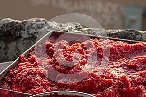 Perspective handmade tomato paste producing process at sunset time