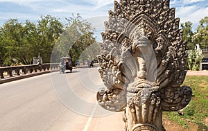 The perspective of an old angkor bridge road with stone statue in Siem Reap, Cambodia