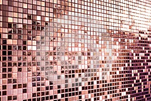 Perspective of pink rose gold square mosaic tiles for background