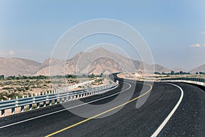 Perspective of a road with mountains in the background