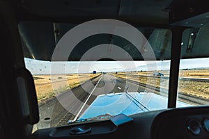 Perspective From a Semi Truck Driver Seat on a Desert Highway