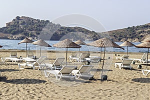 Perspective shoot of sunbeds on coastline of Mediterranean sea in Turkey