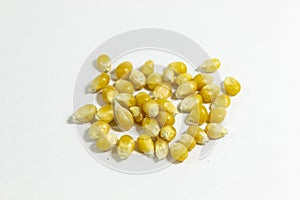 Perspective shot of corn seeds on white background