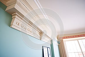perspective shot of a georgian cornice with repeating dentil patterns