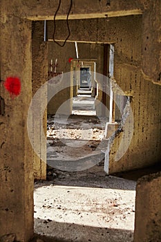 Perspective shot of infinite doorways in an abandoned grain elevator with an ominous feel