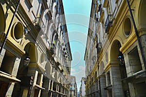 Perspective view of baroque style downtown ancient buildings and arcades Turin Italy