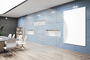 Perspective view on blank white poster with space for advertising logo or text on light blue wall background in spacious