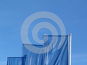 Perspective view of blue flags under blue sky