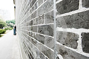 Perspective view of brick wall at park.