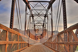 Perspective view a bridge and of its wooden deck