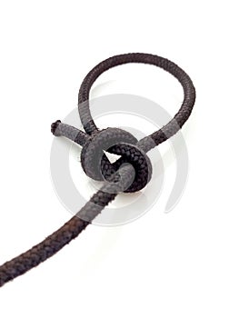 Perspective view of cape with isolated sailor knot. Knot tied in rope on white background. Close up of Loop knot. Navigation and