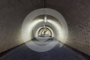 Perspective View Through a Dark Floodlighted Tunnel