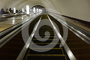 Perspective view down from the moving escalator of Smolenskaya underground station before its renovation.