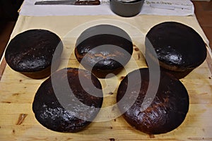 Perspective view of a easter cakes of brown color resting on a light woode