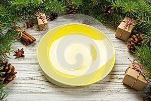 Perspective view. Empty plate round ceramic on wooden christmas background. holiday dinner dish concept with new year decor