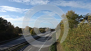 Perspective view at the german highway named A7 with fast traffic