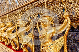 Perspective view of golden religious statue Statue Garuda in wat phra kaew temple, Bangkok, Thailand