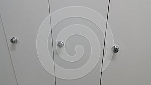 Perspective view of lockers or cupboards in a row with white doors