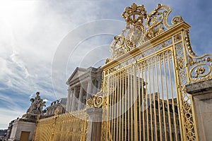 Perspective view of Main golden door and exterior fence at facade of Versailles Palace, Paris, France