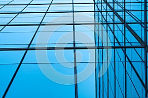 Perspective view of modern futuristic glass building abstract background. Exterior of office glass building architecture.