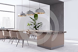 Perspective view of modern kitchen interior design with big marble dining table with chairs, beige walls and contemporary lamps.