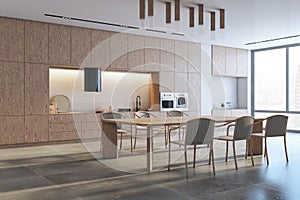 Perspective view of modern kitchen interior design with wooden dining table with chairs, tiles floor and contemporary lamps. 3D