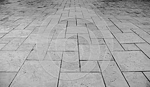 Perspective View of Monotone Grunge Cracked Gray Brick Marble Stone on The Ground for Street Road. Sidewalk, Driveway, Pavers