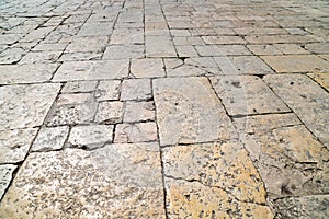 A perspective view of a old brick. Sidewalk tile, the texture of the sidewalk on the Temple Mount in Jerusalem