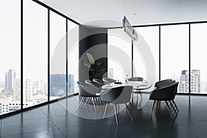 Perspective view on oval white conference table surrounded by black chairs on dark glossy floor in spacious meeting room with city