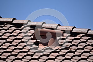 Perspective view of a tile roof and ventilation cover