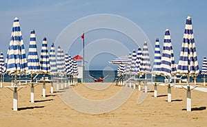 Closed Umbrellas - Rimini Beach, Italy photo