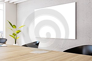 Perspective view of white blank board in modern office meeting room interior with large wooden desk, light wall and window,