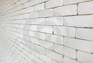 Perspective of white brick wall for texture background