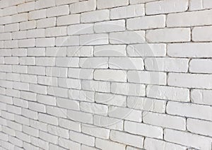 Perspective of white brick wall for texture background