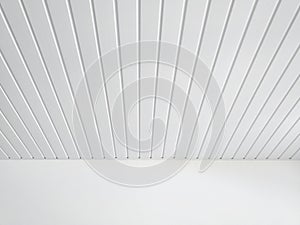 Perspective of white wood sheeting ceiling and smooth white wall in Caribbean construction. White ceiling beams pattern background