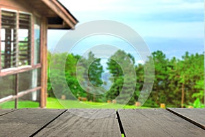 Perspective wood over blur beautiful resort and landscape mountain