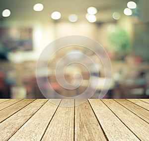 Perspective wood over blurred restaurant with bokeh background