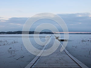 Perspective of Wooden Pier with Winter Snow